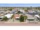 This aerial view shows a private, walled-in backyard with desert landscaping, adjacent to lush golf course views at 9576 E Fairway Blvd, Sun Lakes, AZ 85248