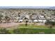 This aerial view showcases a well-established desert community with homes bordering the pristine golf course at 9576 E Fairway Blvd, Sun Lakes, AZ 85248