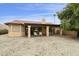 A home with a patio and direct access to a golf course through its well-maintained, xeriscaped backyard at 9576 E Fairway Blvd, Sun Lakes, AZ 85248