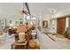 Spacious living room boasting high vaulted ceilings and an open layout to the dining area at 9576 E Fairway Blvd, Sun Lakes, AZ 85248