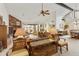 Bright and airy living room featuring high ceilings, a cozy fireplace, and access to the backyard at 9576 E Fairway Blvd, Sun Lakes, AZ 85248