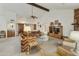 Bright living room featuring high ceilings, neutral carpet, fireplace, and an entertainment center at 9576 E Fairway Blvd, Sun Lakes, AZ 85248