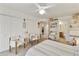 Bright main bedroom with a ceiling fan, two closets, and light-colored walls at 9576 E Fairway Blvd, Sun Lakes, AZ 85248