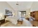 Comfortable main bedroom with a ceiling fan, sliding glass door, and light carpet at 9576 E Fairway Blvd, Sun Lakes, AZ 85248