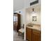 Cozy wet bar area featuring tile countertop, wooden cabinets, and a built-in sink at 9576 E Fairway Blvd, Sun Lakes, AZ 85248