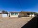 Backyard view showing the covered patio area and rear exterior of the home at 1001 W 17Th St, Tempe, AZ 85281