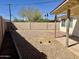 View of the backyard with brick patio and block wall at 1001 W 17Th St, Tempe, AZ 85281