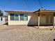 Backyard featuring a covered patio, gravel, and partial views of the home's exterior at 1001 W 17Th St, Tempe, AZ 85281