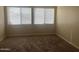 Bedroom featuring a neutral wall color, a carpeted floor and dual windows that let in plenty of natural light at 1001 W 17Th St, Tempe, AZ 85281