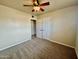 Neutral bedroom with carpet, ceiling fan, double closet, and white doors at 1001 W 17Th St, Tempe, AZ 85281