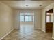 Bright dining room with a stylish chandelier and tile flooring at 1001 W 17Th St, Tempe, AZ 85281