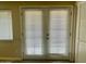Patio doors with blinds allow access to the backyard at 1001 W 17Th St, Tempe, AZ 85281