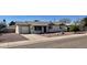 Charming single-story home featuring a well-maintained front yard with mature landscaping and a driveway at 1001 W 17Th St, Tempe, AZ 85281