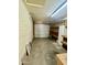 Single-car garage with overhead door, storage shelves, and workbench at 1001 W 17Th St, Tempe, AZ 85281