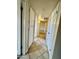 Hallway featuring built-in storage and neutral tile flooring at 1001 W 17Th St, Tempe, AZ 85281