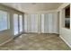 Living room with tile flooring, a patio door, and large closets at 1001 W 17Th St, Tempe, AZ 85281