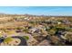 Aerial view of a well-maintained home on a large lot with desert landscaping and a circular driveway at 10800 E Cactus Rd # 7, Scottsdale, AZ 85259