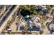 Aerial view showcasing the home's spacious backyard, pool, outdoor dining area, and solar panels at 10800 E Cactus Rd # 7, Scottsdale, AZ 85259