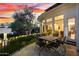 Lovely patio with outdoor table, chairs, and string lights for ambiance at 10800 E Cactus Rd # 7, Scottsdale, AZ 85259