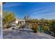 Second story balcony with a built in fire pit overlooking the pool and yard at 10800 E Cactus Rd # 7, Scottsdale, AZ 85259