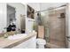 Bathroom with a large shower, tile surround, and vanity with solid surface countertop at 10800 E Cactus Rd # 7, Scottsdale, AZ 85259