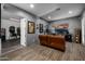 Game and entertainment space with a large television and an open doorway to an adjacent room at 10800 E Cactus Rd # 7, Scottsdale, AZ 85259