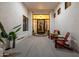 Charming front entrance boasts a grand glass door and cozy seating area at 10800 E Cactus Rd # 7, Scottsdale, AZ 85259