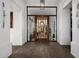 Elegant foyer showcasing a stylish glass door with a clear view of the interior at 10800 E Cactus Rd # 7, Scottsdale, AZ 85259
