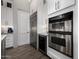 Well-equipped kitchen with stainless steel appliances, sleek cabinets, and a built-in wine cooler at 10800 E Cactus Rd # 7, Scottsdale, AZ 85259