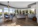 Open-concept living room with panoramic windows, sleek flooring, and a comfortable seating area at 10800 E Cactus Rd # 7, Scottsdale, AZ 85259
