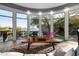 Sun-filled living room with expansive windows offering serene outdoor views at 10800 E Cactus Rd # 7, Scottsdale, AZ 85259