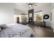 Bright main bedroom featuring a fireplace, ceiling fan, hardwood floors, and lots of natural light at 10800 E Cactus Rd # 7, Scottsdale, AZ 85259
