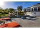 Backyard pool and surrounding patio and landscaping with lounge chairs at 10800 E Cactus Rd # 7, Scottsdale, AZ 85259