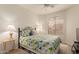 This bedroom features large windows, neutral carpeting and a ceiling fan at 10960 E Monte Ave # 164, Mesa, AZ 85209