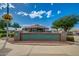 Welcoming Sunland Springs Village Golf Course community sign with lush landscaping and clear blue sky at 10960 E Monte Ave # 164, Mesa, AZ 85209