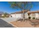 Lovely home featuring a two-car garage, neutral stucco exterior and low-maintenance landscaping at 10960 E Monte Ave # 164, Mesa, AZ 85209