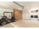 Spacious garage with built-in storage cabinets, golf cart, and a convenient washer and dryer area at 10960 E Monte Ave # 164, Mesa, AZ 85209