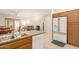 This bright kitchen boasts oak cabinets, granite countertops and seamlessly flows into the living area at 10960 E Monte Ave # 164, Mesa, AZ 85209