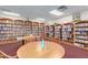 Community library with bookshelves stocked with a variety of books and comfortable seating areas at 10960 E Monte Ave # 164, Mesa, AZ 85209