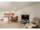 Open-concept living area with an adjacent kitchen, dining area and a cozy seating arrangement at 10960 E Monte Ave # 164, Mesa, AZ 85209