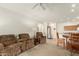 Spacious living area with plush seating, adjacent dining space, and a bright and airy atmosphere at 10960 E Monte Ave # 164, Mesa, AZ 85209