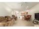 Inviting open concept living space with cozy seating, a dining area, and tile flooring at 10960 E Monte Ave # 164, Mesa, AZ 85209