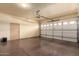 Spacious two-car garage with epoxy floor and ample storage space at 11351 E Pampa Ave, Mesa, AZ 85212