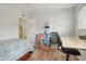 Well-lit bedroom with desk, stylish lamp, built-in closet and staircase access at 1144 N 85Th Pl, Scottsdale, AZ 85257