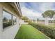 Beautiful backyard featuring artificial turf, mature landscaping, and view of the community at 12243 S Chippewa Dr, Phoenix, AZ 85044