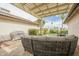 Outdoor patio featuring a shaded seating area, grill, and well-maintained landscaping at 12243 S Chippewa Dr, Phoenix, AZ 85044