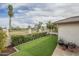 Serene backyard with artificial grass, hedges, and views of the golf course at 12243 S Chippewa Dr, Phoenix, AZ 85044