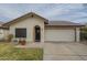 Charming single-story home with a two-car garage and a welcoming front entrance at 12243 S Chippewa Dr, Phoenix, AZ 85044