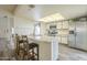 Well-lit kitchen with modern appliances, a breakfast bar, and light countertops at 12243 S Chippewa Dr, Phoenix, AZ 85044
