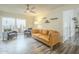 Bright living room featuring modern floors, and glass doors to the patio at 12243 S Chippewa Dr, Phoenix, AZ 85044